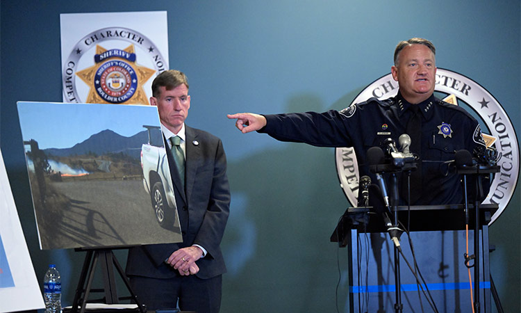 Boulder County Sheriff Curtis Johnson (right) speaks during a press conference on the investigative outcome into the cause and origin of the 2021 Marshall Fire, at the Boulder County Sheriff’s Office in Boulder, Colorado. AP
