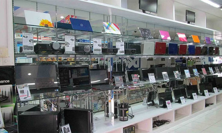 Laptops and tablets are arranged on racks at a computer shop in Bengaluru. (Photo via Facebook)
