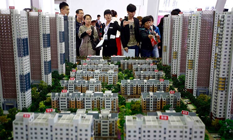 Models of apartments at a real estate exhibition in Shenyang, China. Prices are falling for both new and old apartments. Reuters