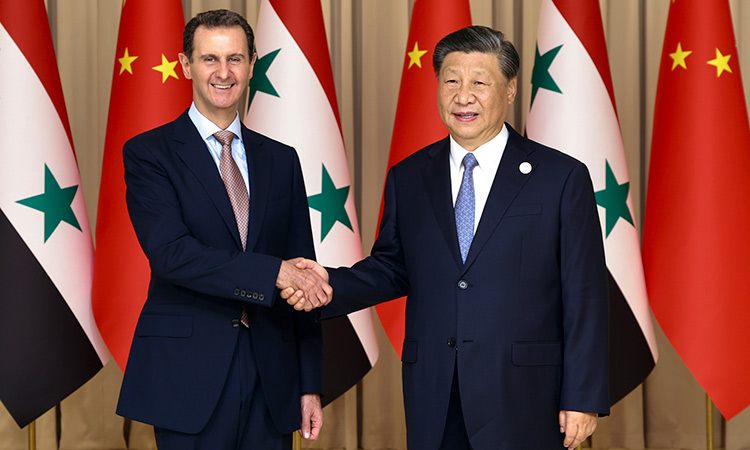 Chinese President Xi Jinping (right), shakes hands with Syrian President Bashar Assad before their bilateral meeting in Hangzhou, China.  AP