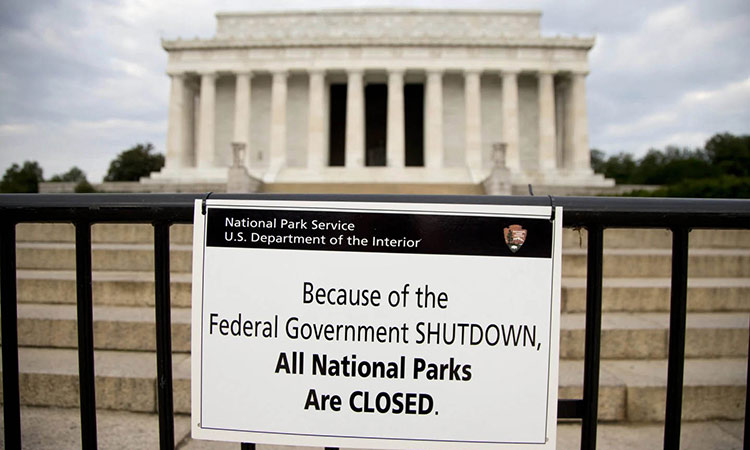 A sign reading ‘Because of the Federal Government SHUTDOWN All National Parks are closed’ is posted on a barricade in front of the Lincoln Memorial in Washington.  Associated Press