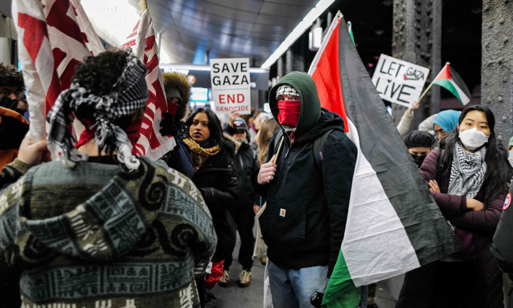 Pro-Palestine protesters gather at Jamaica train station in New York City. Agence France-Presse