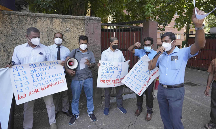 Sri Lankan government medical officers protest outside the national hospital in Colombo, Sri Lanka. AP