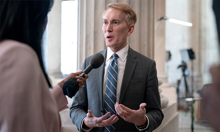 Sen. James Lankford, R-Okla., the lead GOP negotiator on the Senate border and foreign aid package, does a TV news interview on Capitol Hill at the Capitol in Washington. AP