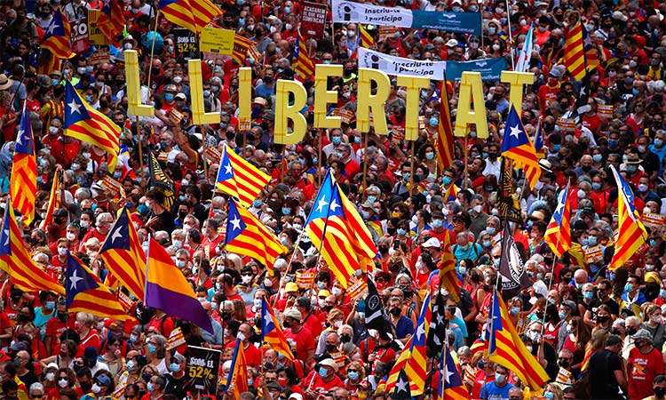 People hold up Estelada flags (Catalan separatist flag) during Catalonia's national day, 'La Diada', in Barcelona, Spain. File/Reuters