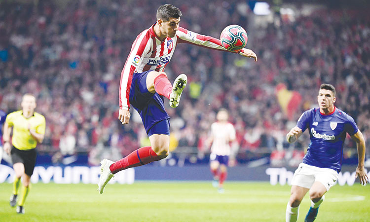 Granada go top;  Costa left out as Morata on target again in Atletico victory