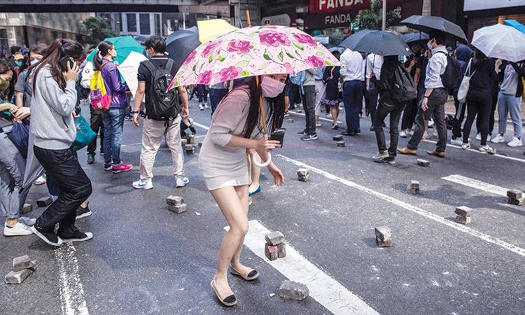 Protesters block varsities  as chaos grips Hong Kong