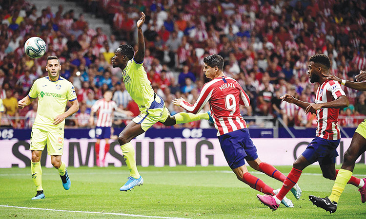 Atletico make winning start; Reguilon scores on Sevilla debut