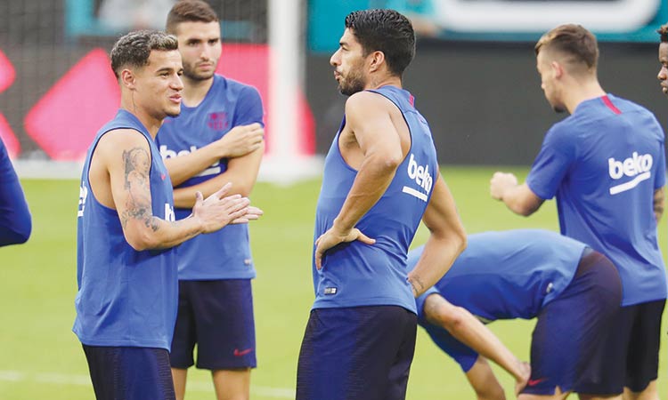 Barcelona’s Philippe Coutinho (left) with team-mates during a practice session in Miami on Tuesday.  Associated Press