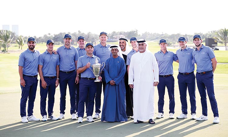 Members of the Continental Europe team pose with the trophy along with the dignitaries.