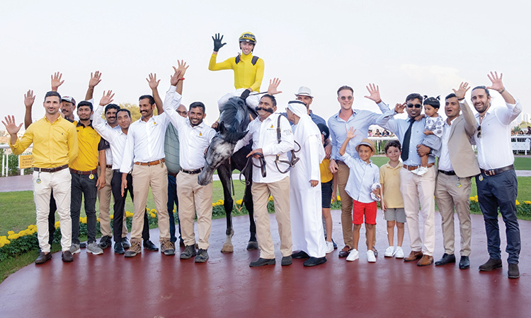 Trainer Michael Costa, jockey James Orman and staff members of Jebel Ali Stables celebrate following their victory in Orient Irrigation Services Cup.