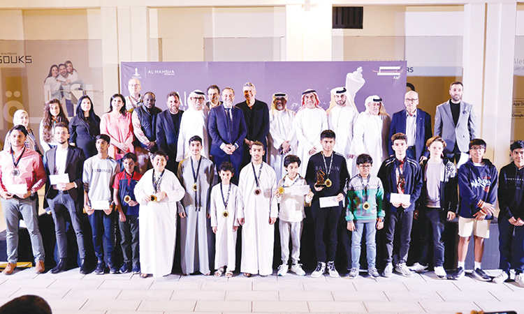 Winners pose with the dignitaries after the presentation ceremony.