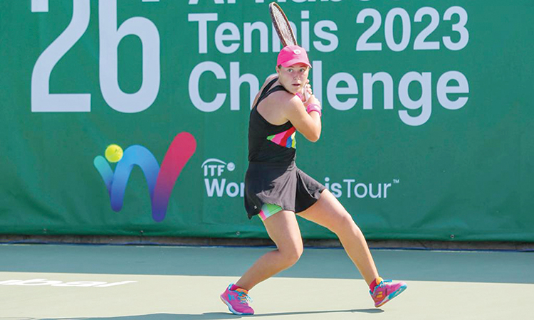 Ksenia Zaytseva returns to Timea Babos during their match at the 26th Al Habtoor Tennis Challenge.