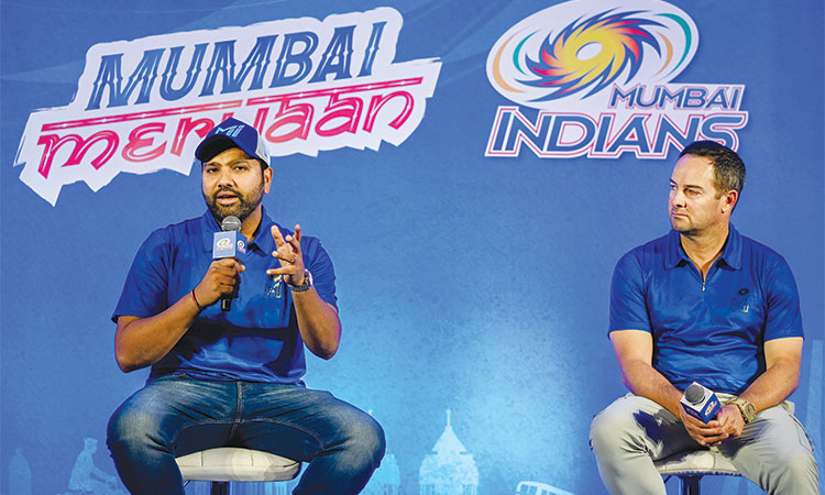 Mumbai Indians’ captain Rohit Sharma (left) speaks as coach Mark Boucher watches during a news conference in Mumbai.  Agence France-Presse