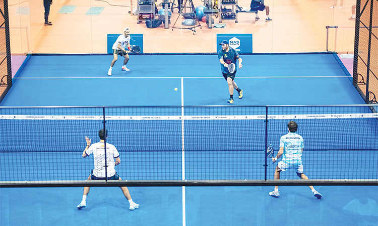 Players in action during their Padel Championship match at the NAS Sports Tournament in Dubai.