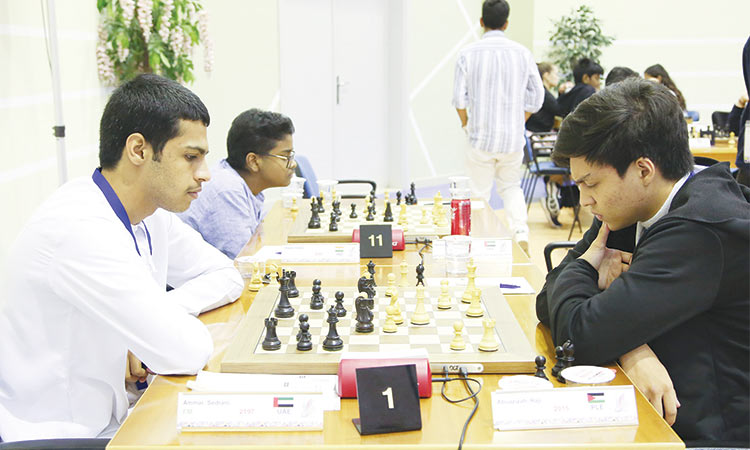 Top-seed FM Ammar Sedrani of the UAE and Palestine’s Abuazizah Raji in action during the fourth round game of the Dubai Open Chess Tournament.