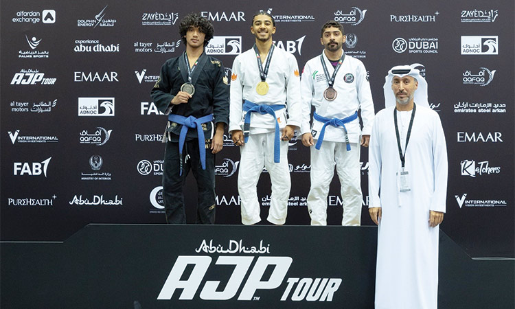 Winners pose on the podium during the presentation ceremony.