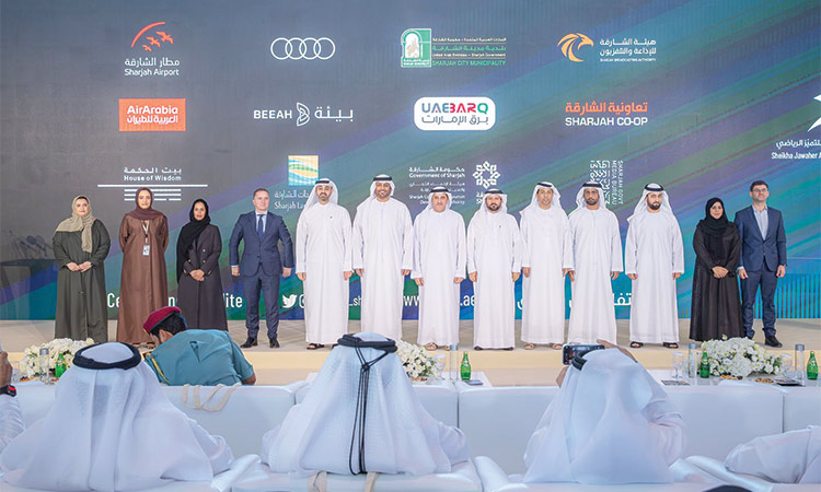 Eisa Hilal Al Hazami, Najla Abdullah Al Shamsi, Ali Salem Al Midfa, Khalid Jasim Al Midfa and other dignitaries pose for a picture after the press conference.