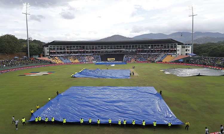  Rain covers are pulled over the pitch as rain stops the Asia Cup cricket match between India and Pakistan at Pallekele, Sri Lanka. File  /AP