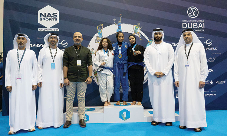 Winners with Nasser Aman Al Rahma, Hassan Al Mazrouei and other dignitaries during the presentation ceremony.