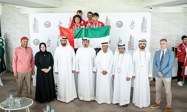 Winners of the golf event pose with Sheikh Fahim Bin Sultan Al Qasimi, Faris Mohammed Al-Mutawa and other officials during the presentation ceremony.