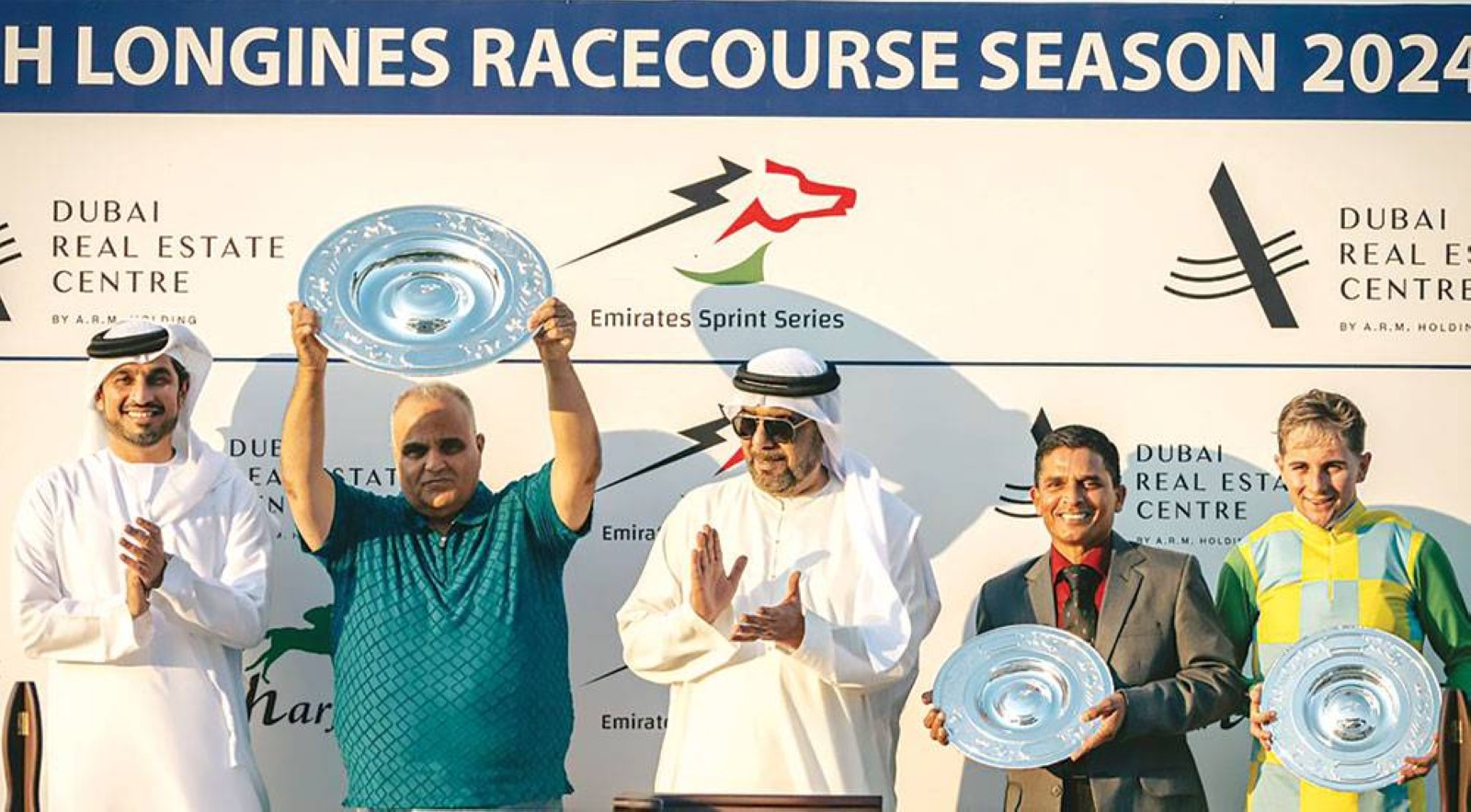 Nasir Askar with Sheikh Abdullah Bin Mohammed Al Qasimi and Mohammed Saeed Al Shehhi during presentation ceremony.