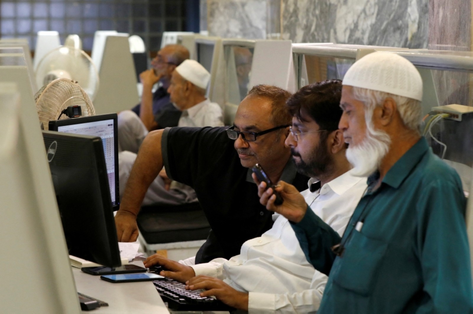 Pakistan’s benchmark share index crosses 100,000 for first time