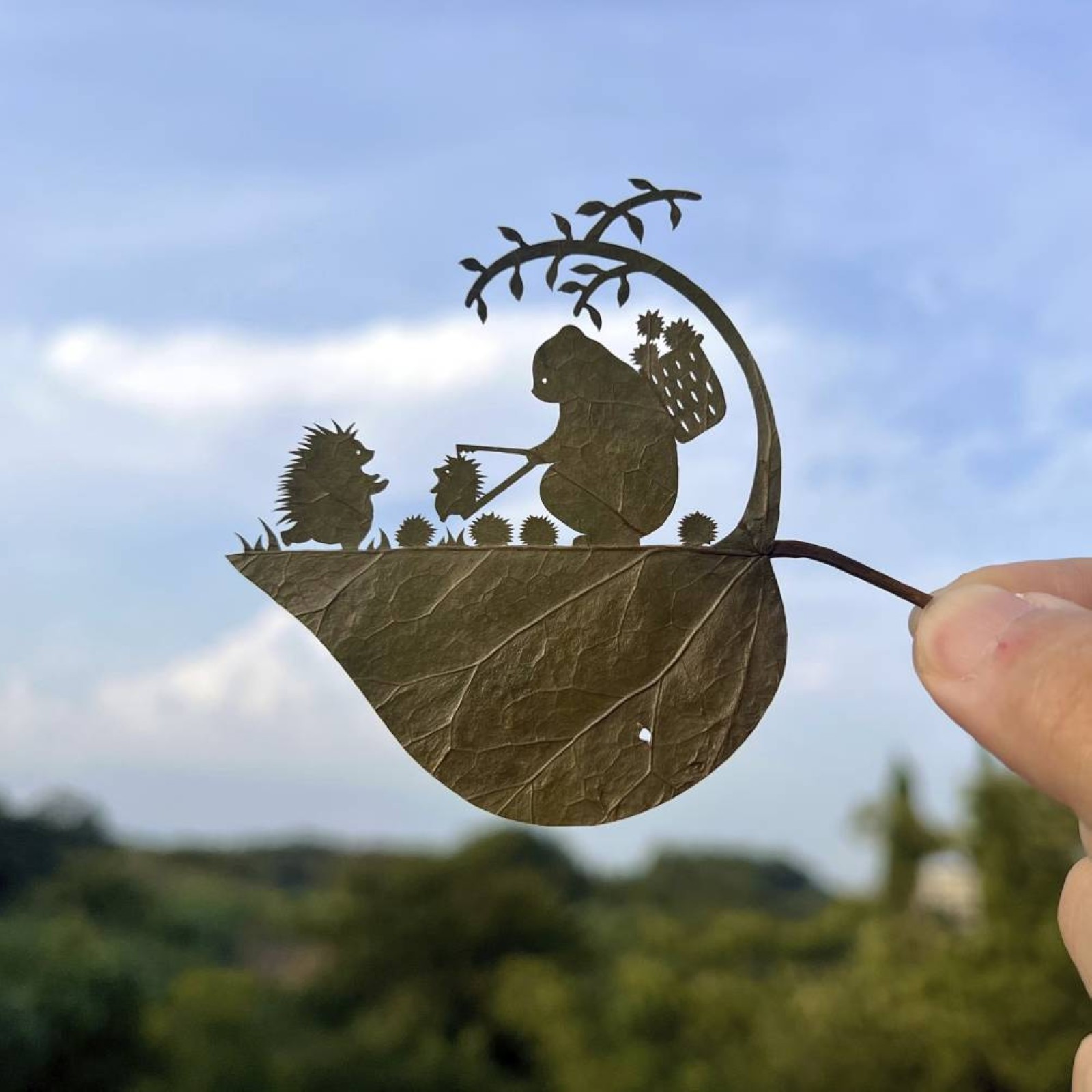 A Japanese artist finds solace and global fans with intricate leaf-cutting
