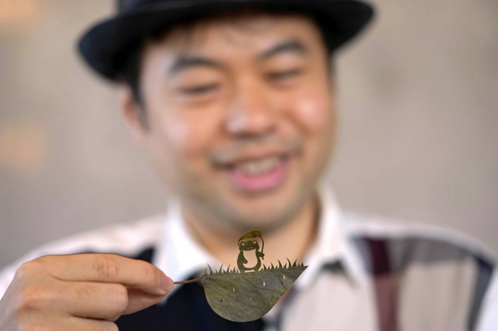 A Japanese artist finds solace and global fans with intricate leaf-cutting