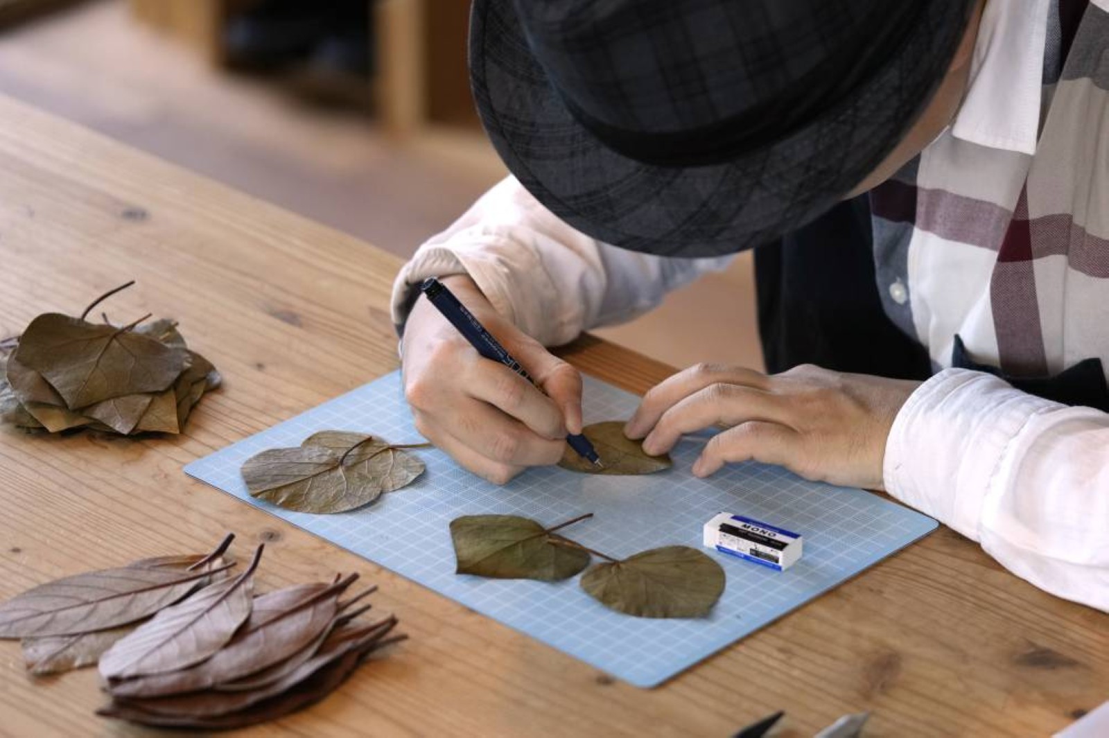 A Japanese artist finds solace and global fans with intricate leaf-cutting
