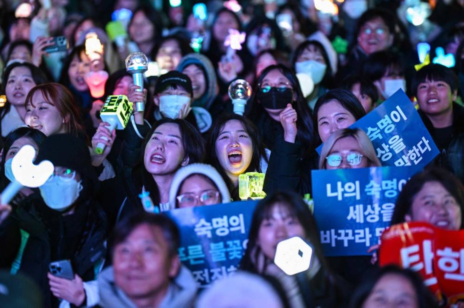 Jubilant South Koreans celebrate President Yoon’s impeachment in freezing Seoul