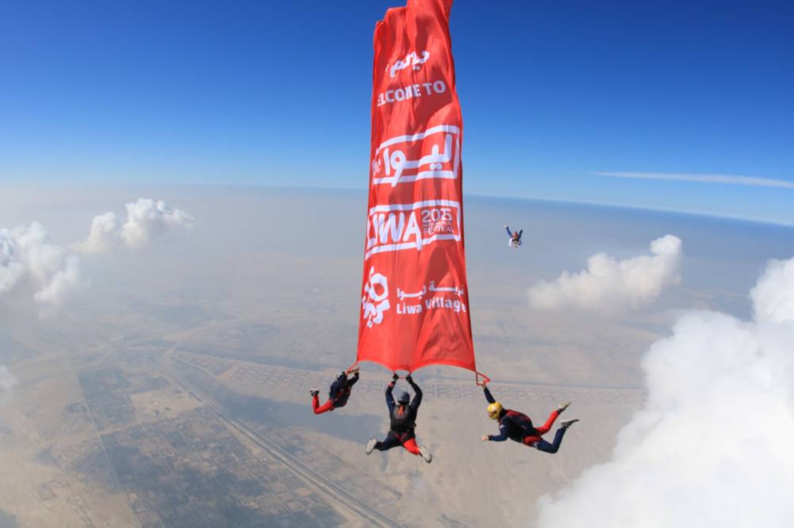 Skydiving instructors make thrilling leap over Liwa Dunes