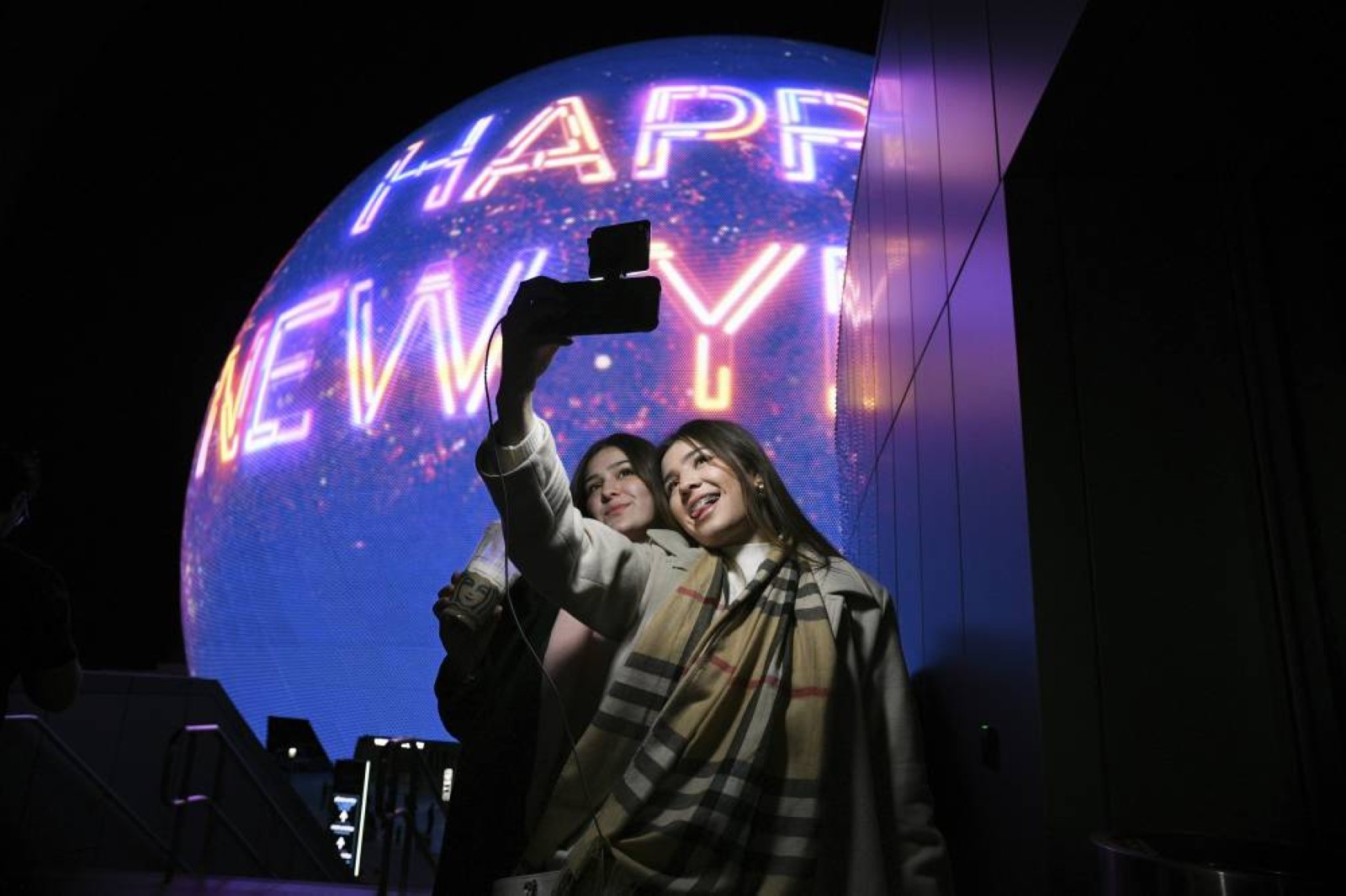 The world welcomes 2025 with light shows, embraces and ice plunges
