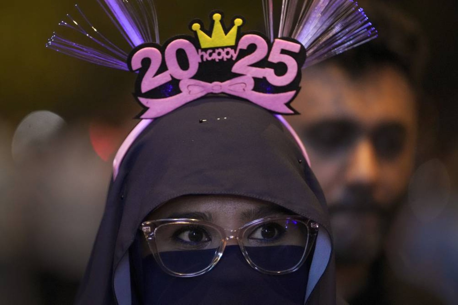 The world welcomes 2025 with light shows, embraces and ice plunges