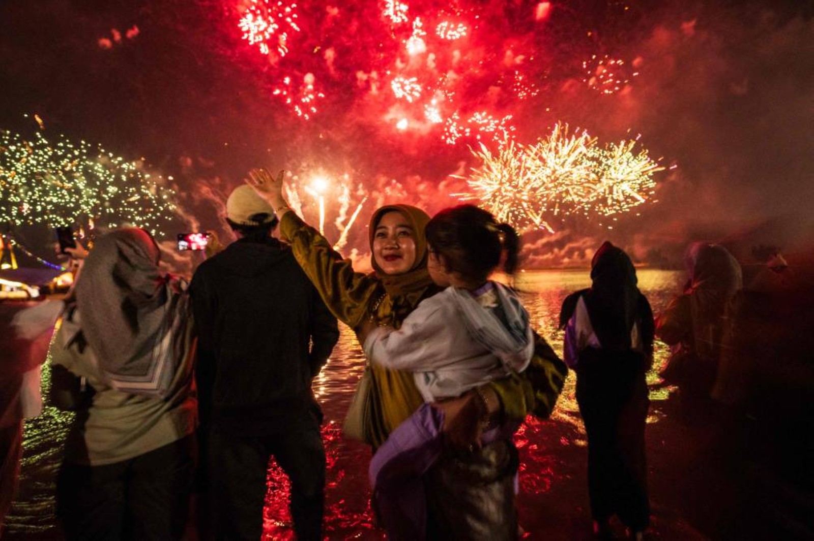 The world welcomes 2025 with light shows, embraces and ice plunges