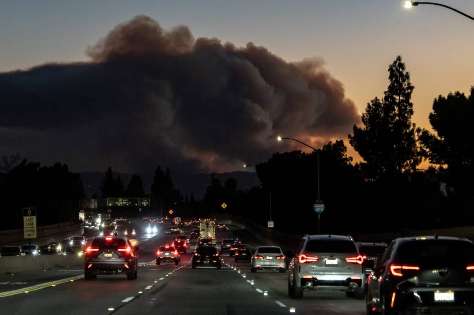 Smoke rises over the hills from the Palisades Fire near Santa Monica, Los Angeles County. Reuters