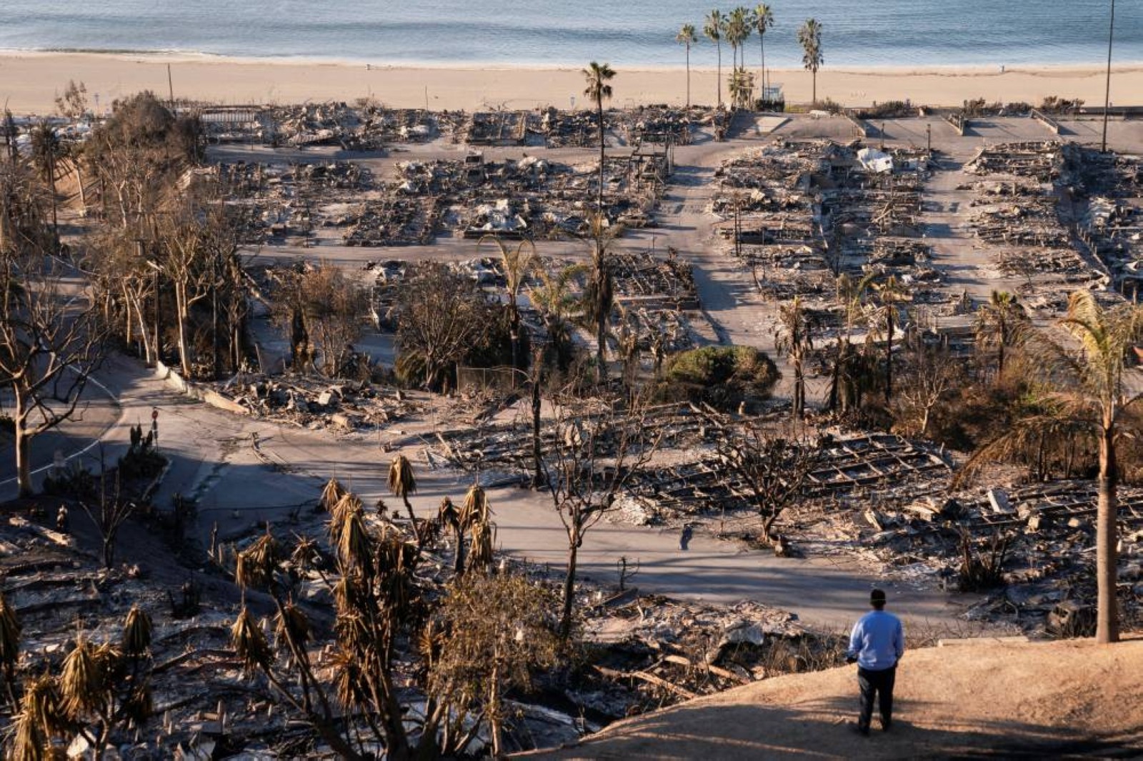 Firefighters race to beat Los Angeles blazes as winds grow; toll hits 16