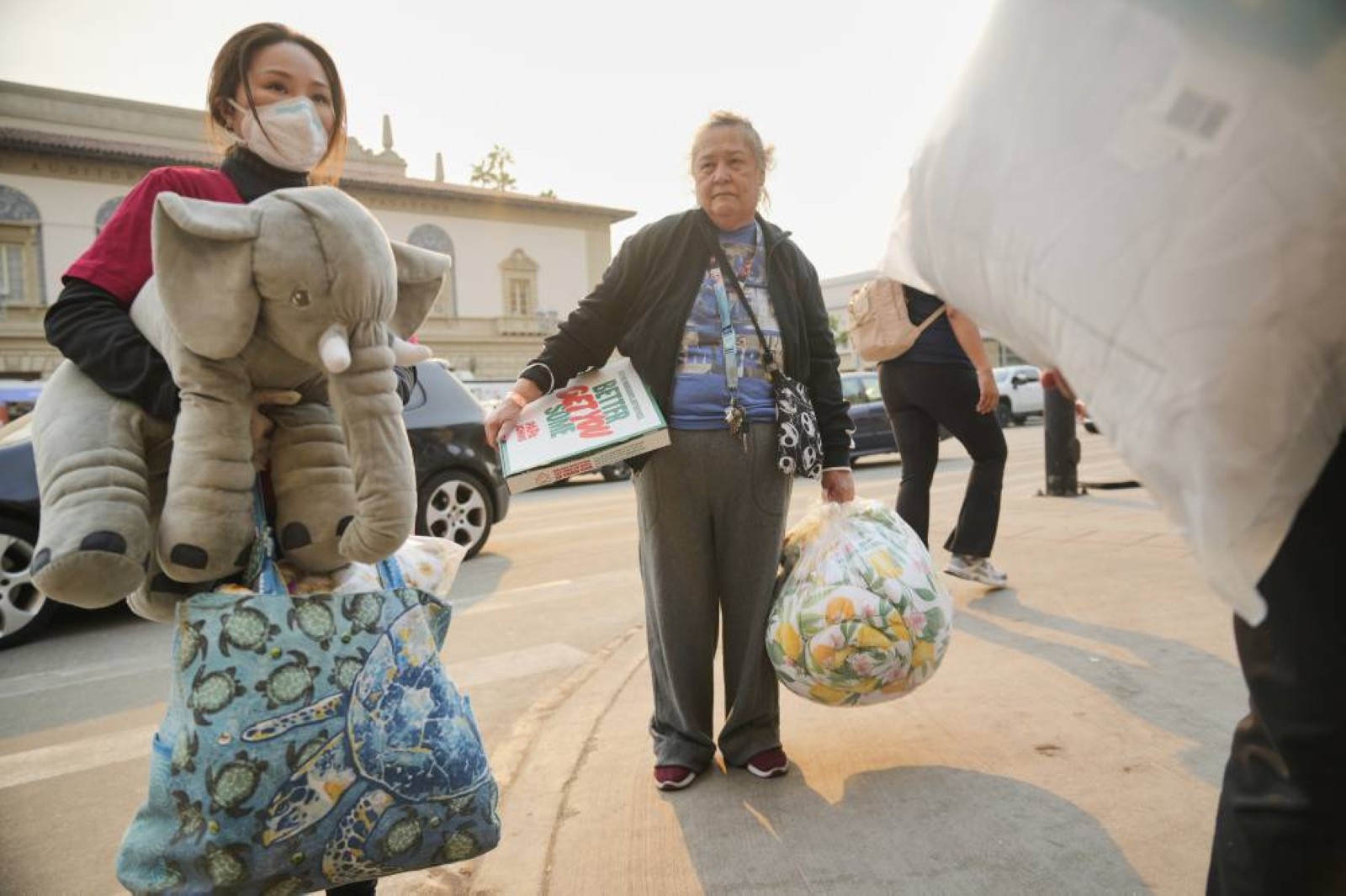 Firefighters race to beat Los Angeles blazes as winds grow; toll hits 16