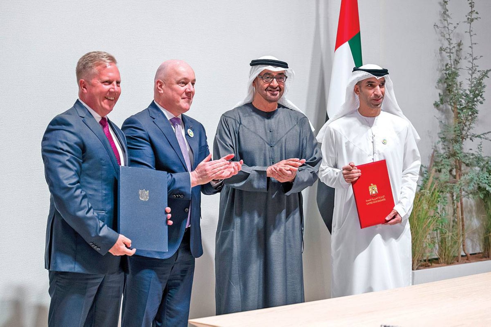 President Mohamed Bin Zayed and New Zealand Prime Minister Christopher Luxon mark the signing ceremony with other officials in Abu Dhabi on Tuesday. WAM