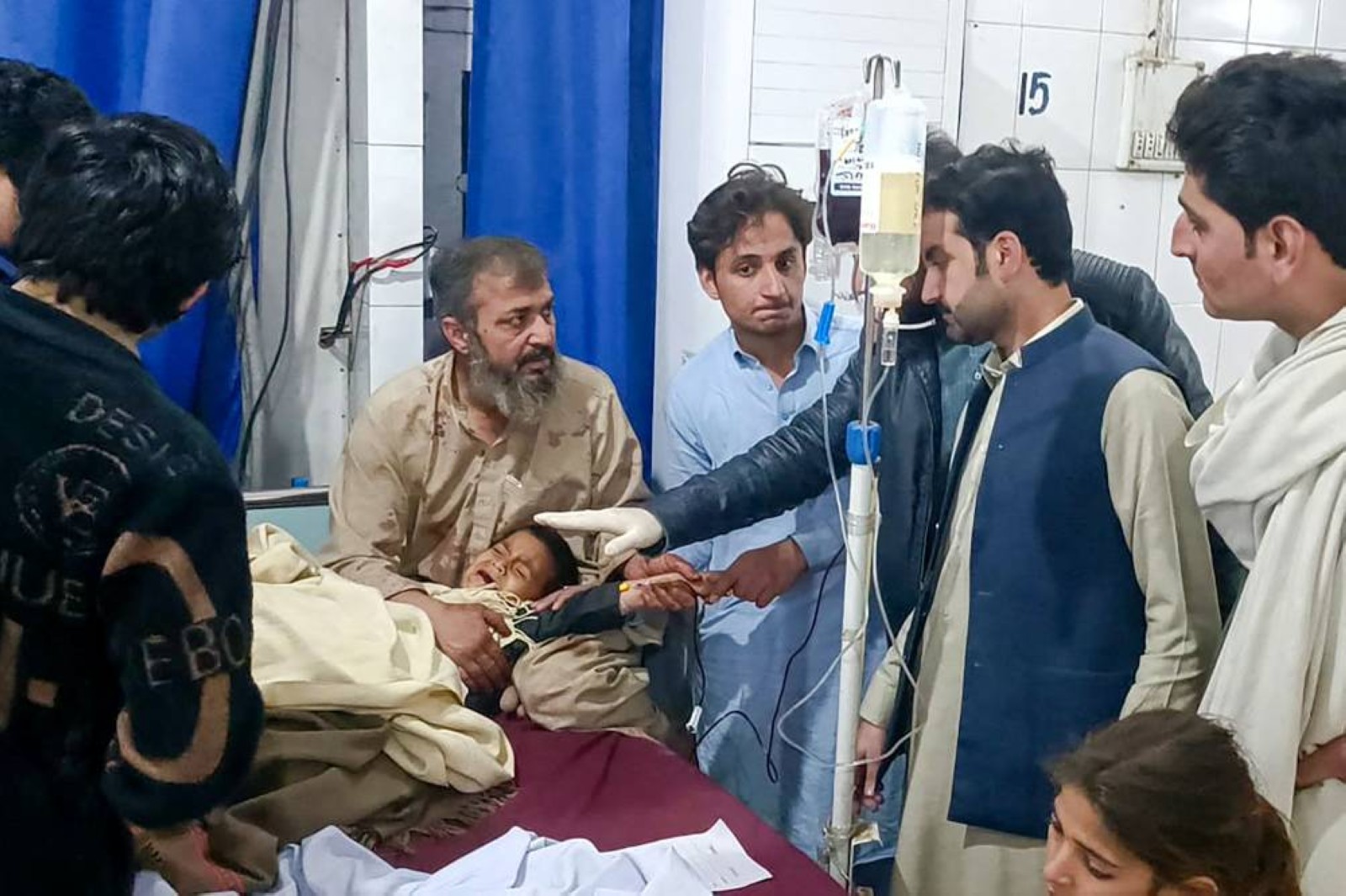 Pakistanis mourn 18 people killed in suicide bombing at an army base