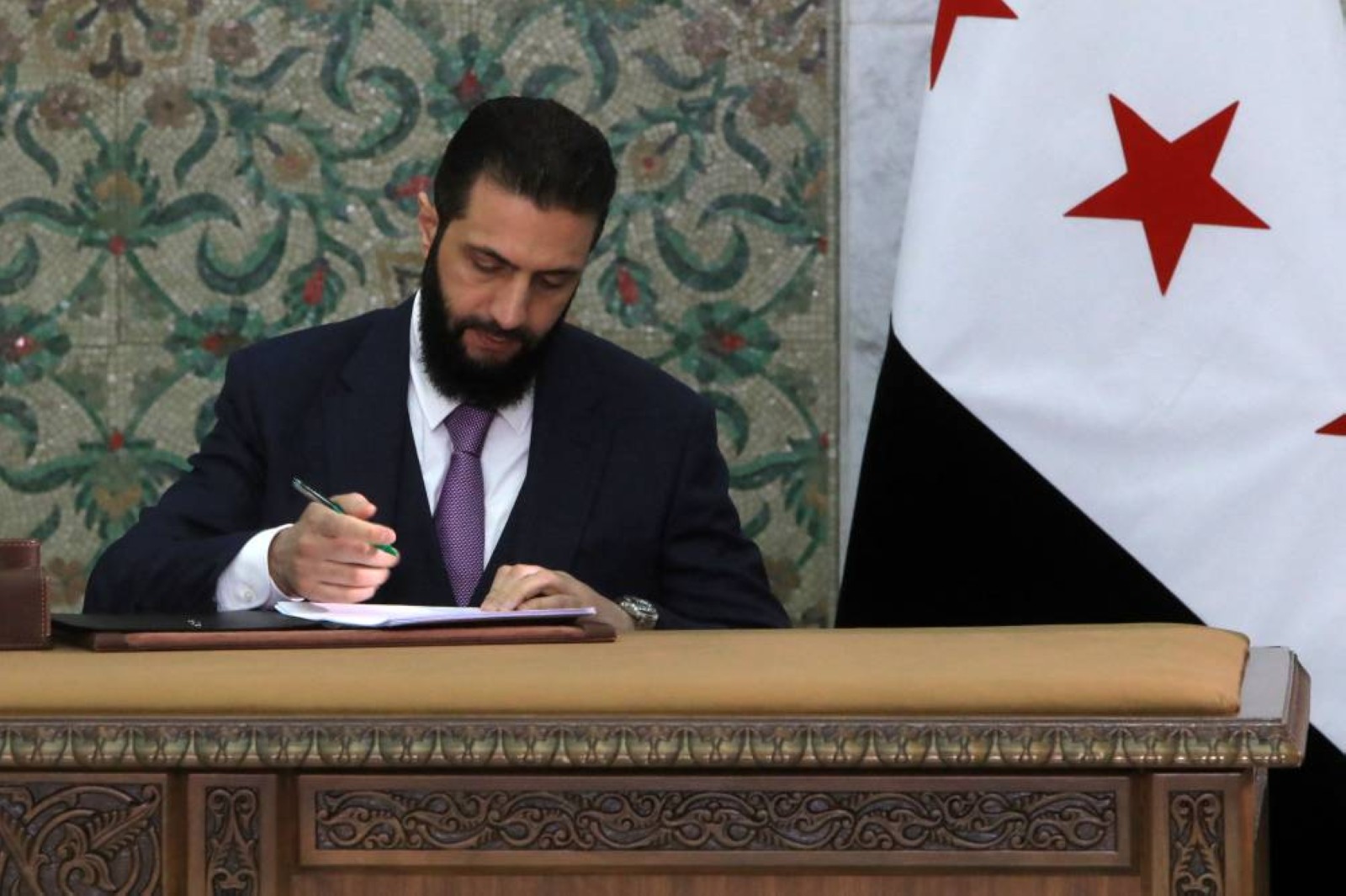 Syria leader signs constitutional declaration, hailing 'new history'