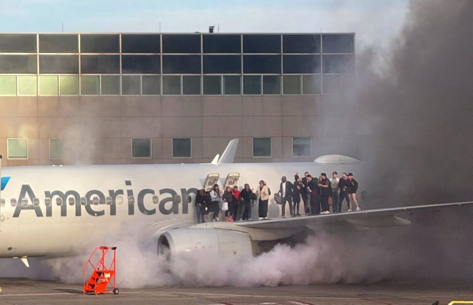 American Airlines jet engine catches fire after landing in Denver, 12 injured