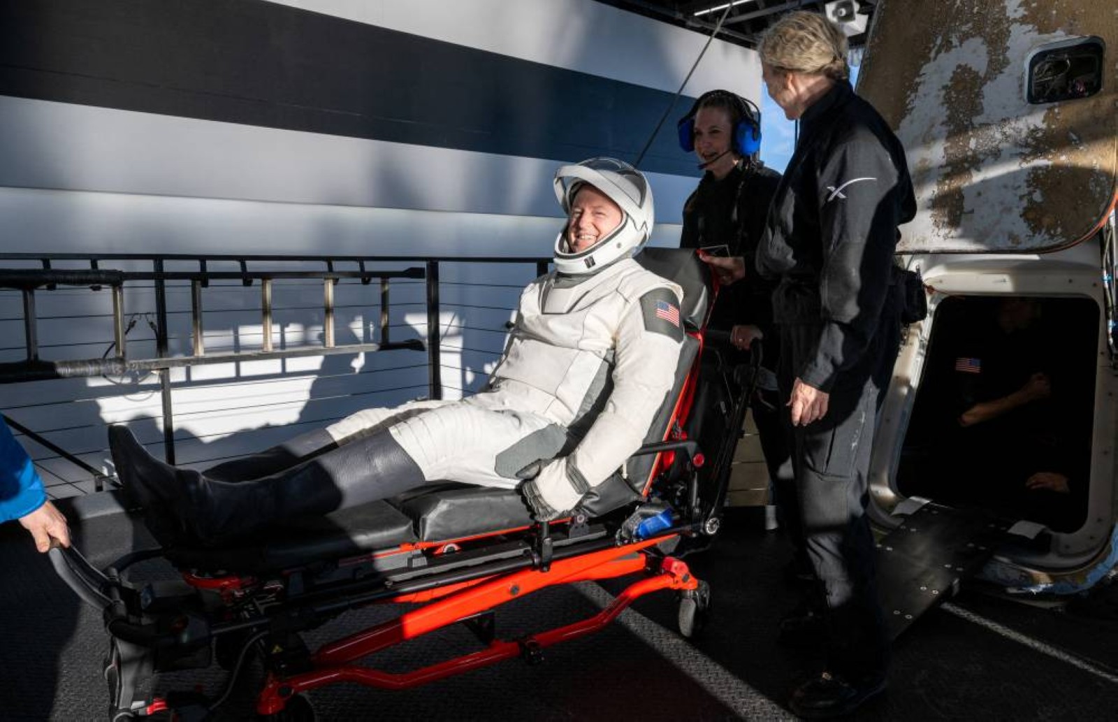 Smiles, thumbs ups and playful dolphins mark stranded Nasa astronauts' return to Earth