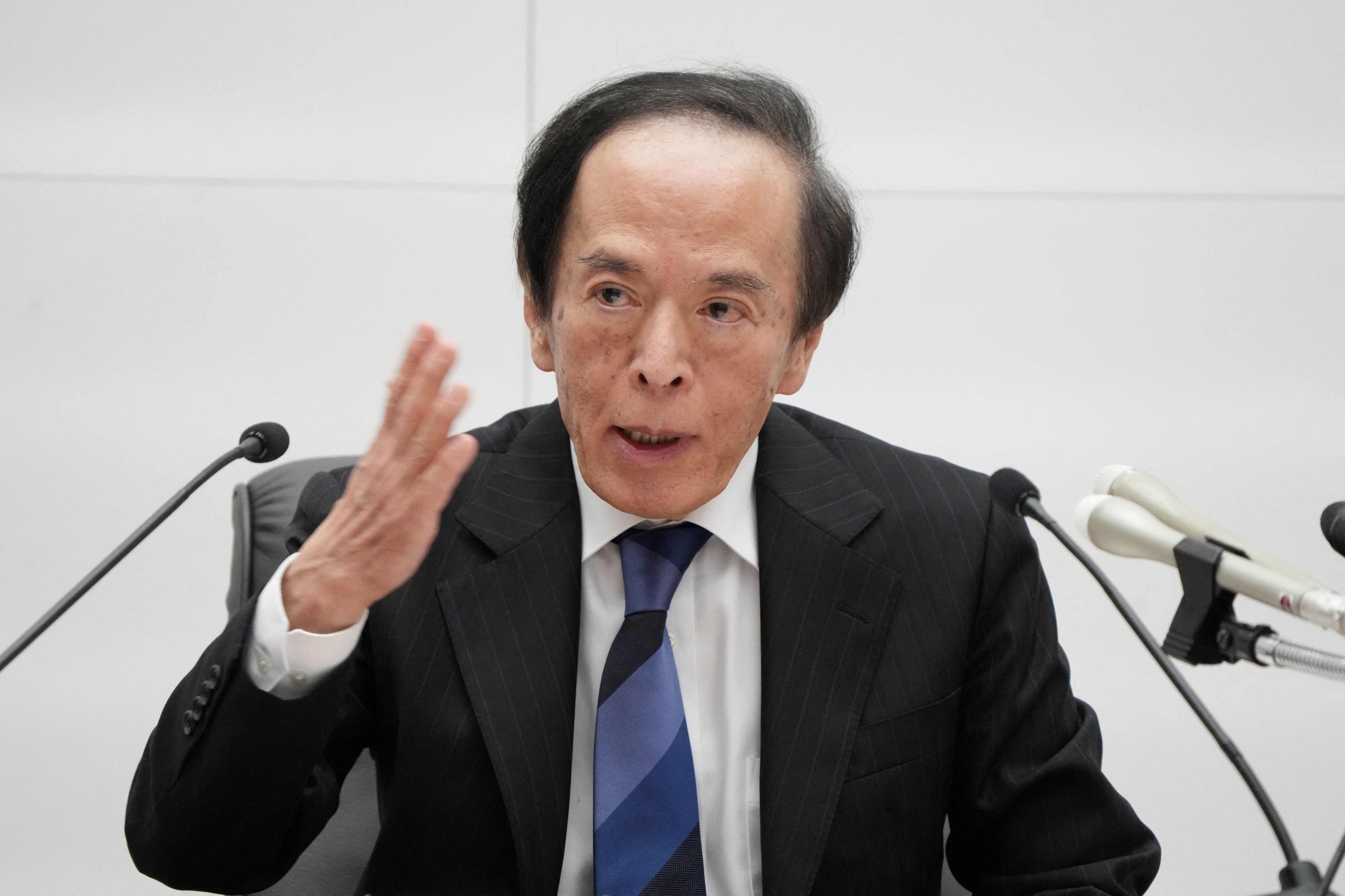 BoJ keeps rates steady, slashes growth forecasts on US tariff hit