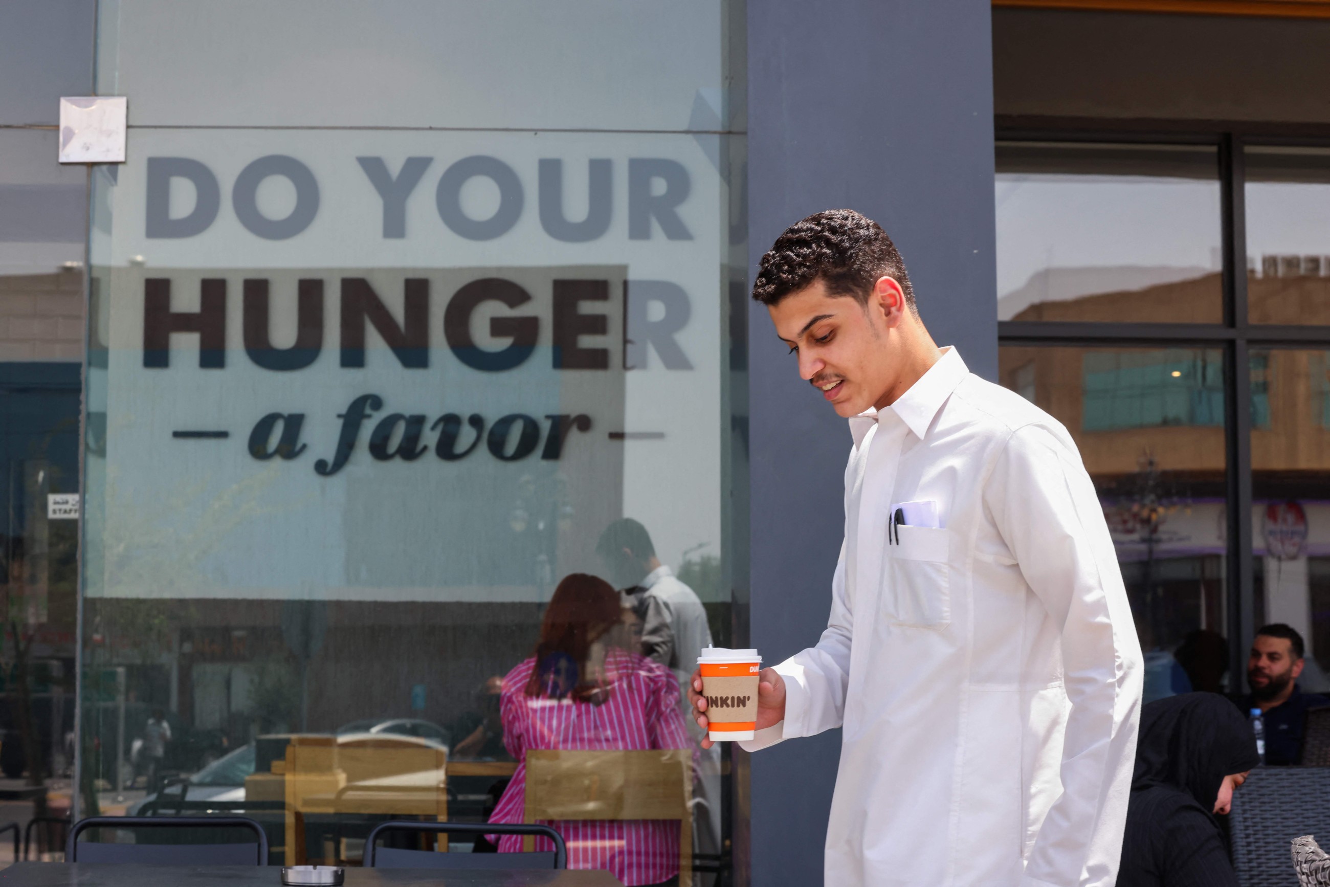 Chicken wings, donuts, SUVs: Saudis simply love American food, cars, movies