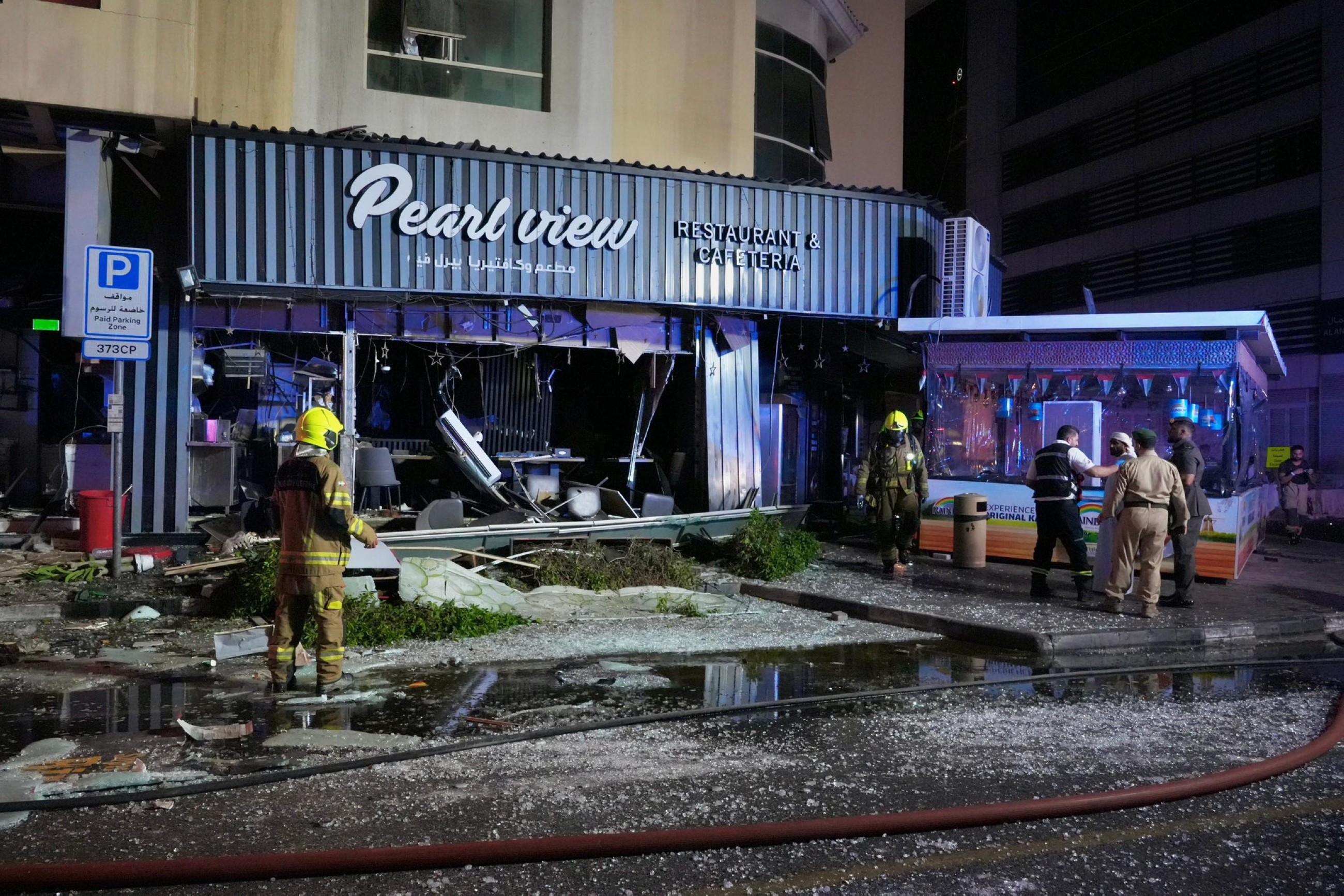 Dubai Civil Defence personnel work at the site of the fire in Al Barsha, Dubai. 