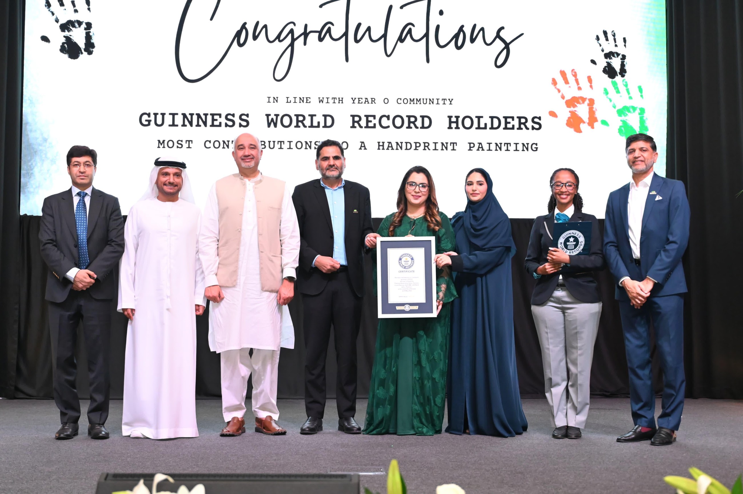 Pakistan Association Dubai creates largest UAE flag with 24,514 handprints, enters Guinness