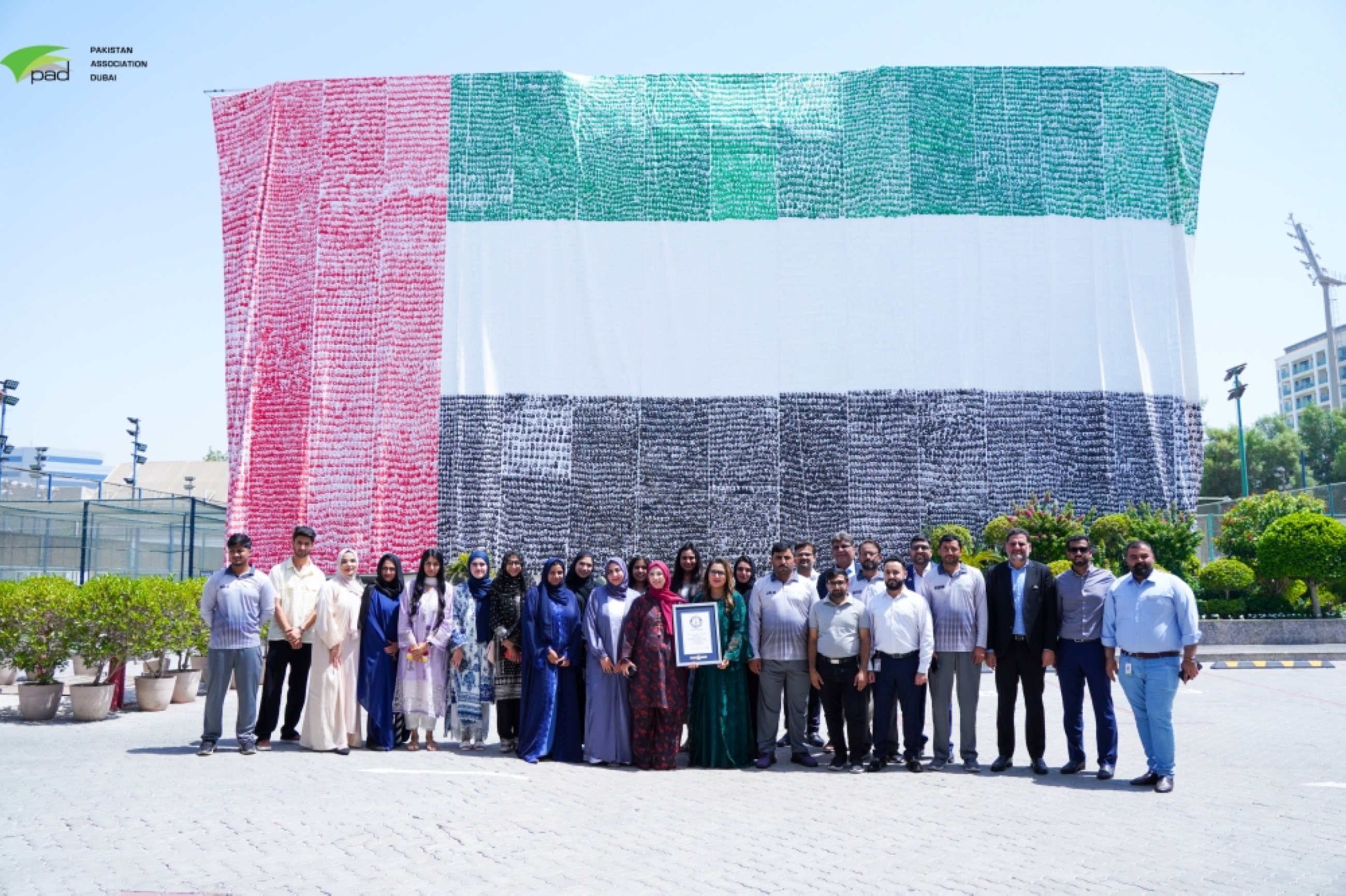 Pakistan Association Dubai creates largest UAE flag with 24,514 handprints, enters Guinness