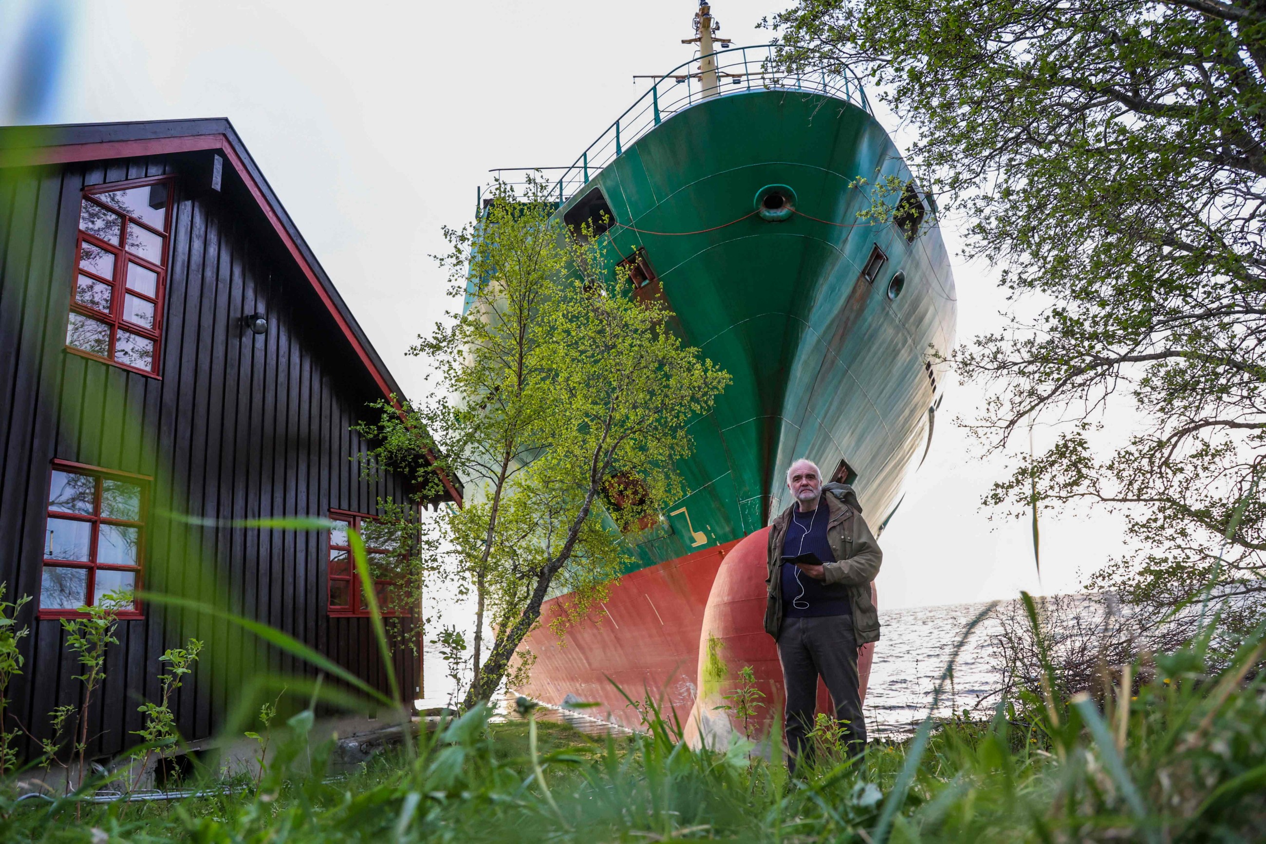 Norwegian man wakes up to find a grounded cargo ship next to his home