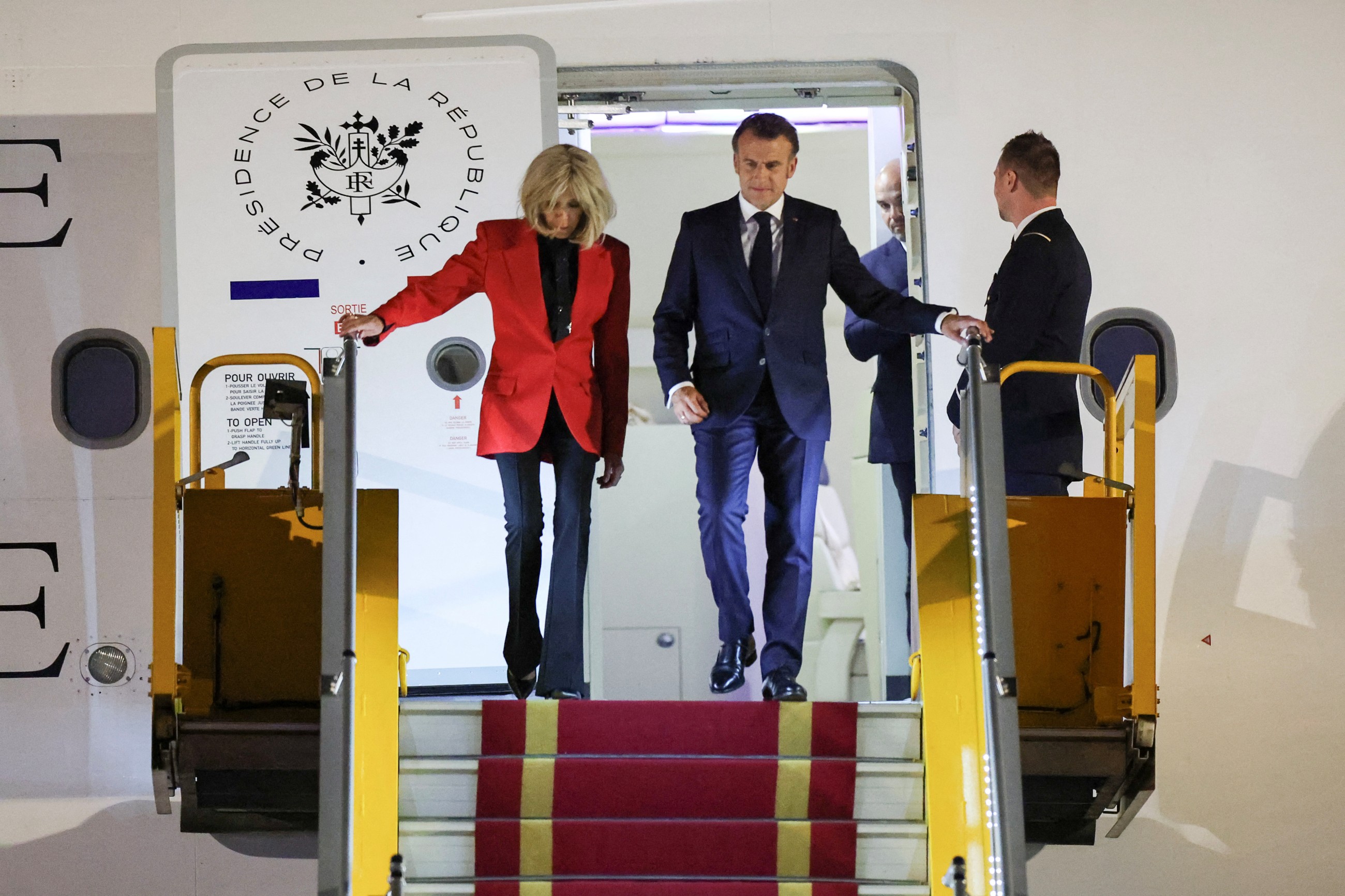 French President Macron pushed on face by wife, video goes viral